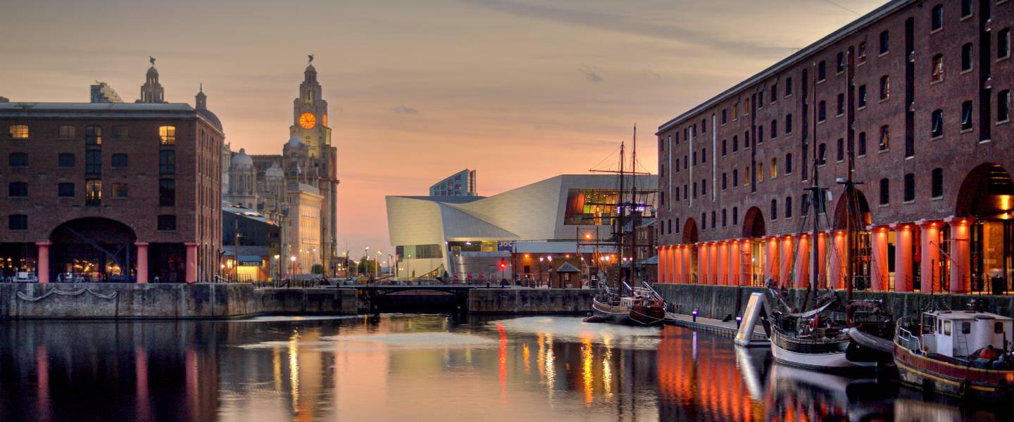 a body of water with boats in it and buildings around it